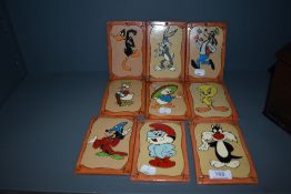 A set of nine mid century plaques of cartoon and Disney interest
