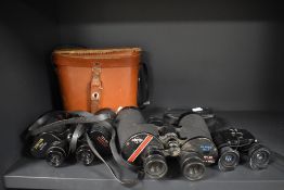 Three pairs of binoculars including Tohyoh 12x50, Swift Ranger 10x50 and Companion 8x21