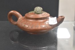 A fine early 20th century Chinese Zisha Yixing teapot or sake vessel with double carp handle and