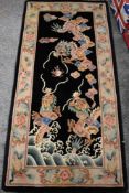 A modern Chinese style carpet runner in beige and black ground with a floral and fruit border