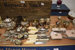 A selection of 20th century cutlery and flatwares with a Sheffield silver plated tea set