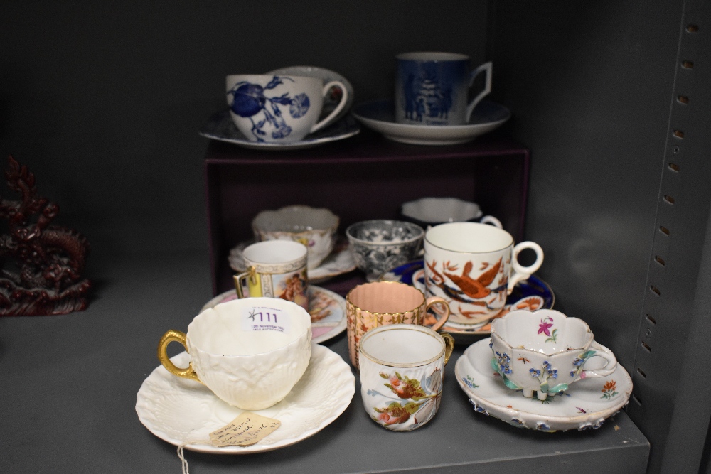 A selection of antique and later tea cup and saucer sets including Royal Copenhagen, Coalport and