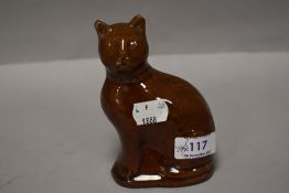 A late 19th century treacle glazed money box or bank in the form of a tabby cat. Damage to cats