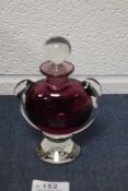 A vintage David Wallace studio art glass scent bottle with cranberry body