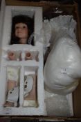 A modern make your own doll kit with porcelain body parts and instructions