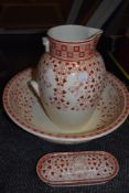 An early 20th century Mintons wash stand set having red pattern on cream ground, Af.