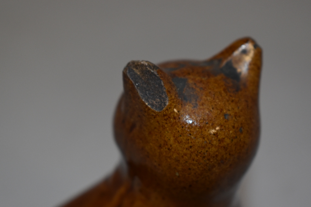 A late 19th century treacle glazed money box or bank in the form of a tabby cat. Damage to cats - Image 2 of 3