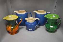 Five Art Deco design ceramic water jugs in various colours and glazes