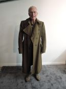 A early/mid 20th century British Army Great Coat, medium size, no labels, named to Richard Giles