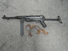 A Denix reproduction metal MP40 Sub Machine Gun with magazine and strap, boxed