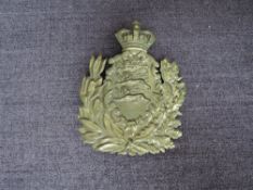 A Brass Helmet Plate to the Duke of Lancaster`s Own Yeomanry, crown over a foliate shield