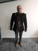 An early 20th century Royal Artillery Officers Dress Tunic having nine brass buttons to front and