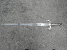 A reproduction medieval Knights Sword, blade length 94cm, overall length 120cm