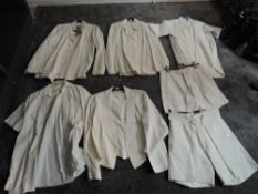 A collection of mid 20th century British Navy White Uniform including two No1 Dress Tunics without