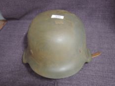 A German WW2 M42 Army Helmet with single decal to right hand side of Waffen SS, size 59, with chin