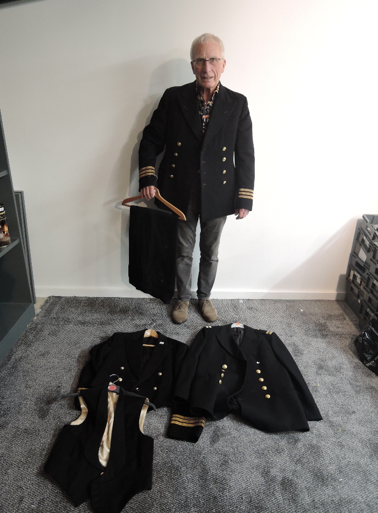 A Naval Engineers Mess Jacket having gold and purple stripes to sleeves and 8 brass buttons with