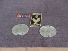 Two German WW2 Dog Tags, possibly marked SS-PZ.GP.RGL.Germania and SS-PZ.GR.RGT.Geutschlano along