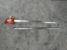 A Reproduction Scottish Basket Hilt Broadsword with metal scabbard, blade length 84cm, overall