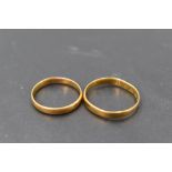 Two small 22ct gold wedding bands, sizes H & L and approx 3.3g