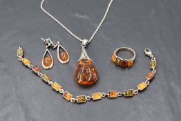 Four pieces of Baltic amber and silver jewellery