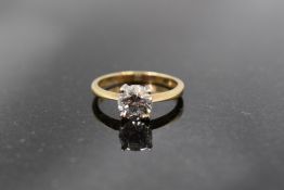 A cubic zirconia solitaire ring in a 4 claw raised mount on 9ct gold loop,size L & approx 2.2g