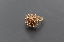 A 9ct gold ring of stylised ball and spike form, size N & approx 4.5g