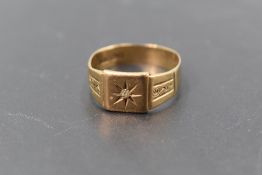 A gent's 9ct gold signet ring having a small inset diamond chip in starburst mount to rectangular