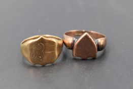 Two 9ct gold signet rings, each with shield form platforms, one with engraved detail, each marked .