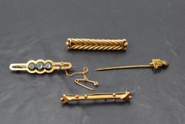 Three yellow metal/9ct gold bar brooches and a stick pin, of various forms, approx 10.5g