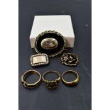 A selection of Victorian and later mourning jewellery including two 18ct gold and enamel rings, a