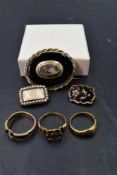 A selection of Victorian and later mourning jewellery including two 18ct gold and enamel rings, a