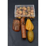 Four pieces of amber including a brooch and pendant and some loose beads