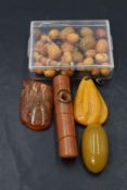 Four pieces of amber including a brooch and pendant and some loose beads