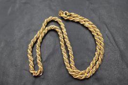 An 18ct white and yellow gold rope chain, approx 20' & 24.3g