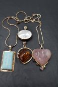 Four silver and white metal pendants, (two with chains) of various forms, including rose quartz,