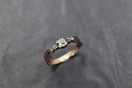 An antique five stone old cut diamond ring, possibly Georgian having black enamel decoration to