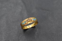 A 15ct gold band ring having turquoise and seed pearl decoration, size L/M & approx 2.4g