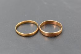 An 18ct gold wedding band, of plain circular form, marked 18, ring size I/M, 1.8grams, sold along