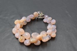 A multi stone polished pebble agate bracelet with crystal bead and loop clasp