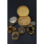 Five vintage brooches having pinchbeck mounts, including reversible hair locket, a part set of