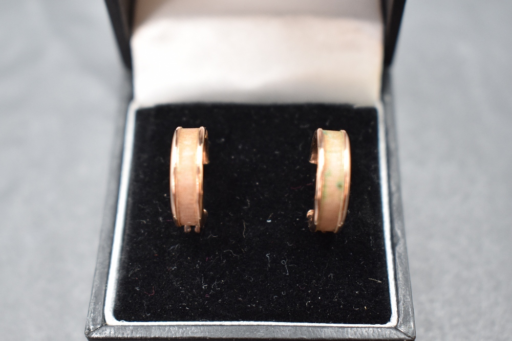 A pair of 9ct rose gold hoop earrings having brushed detail, approx 1.3g