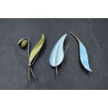 Two Norwegian silver and enamel brooches in the form of leaves and flower bud, and a Danish silver