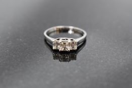 A princess cut diamond trio dress ring, total approx 0.65ct in a claw set stepped looped mount on an