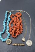 A small selection of jewellery including a long string of branch coral, mosaic brooches, silver St