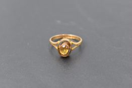 A small Victorian ring having oval citrine in open collared mount on 9ct gold loop, size K &