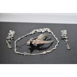 A small selection of marcasite jewellery including necklace, earrings and oversized fighting
