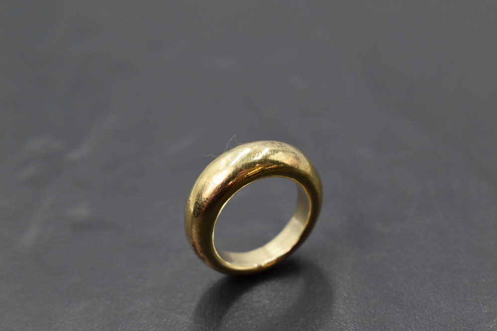 A yellow metal plain moulded band ring, marks worn, size K & approx 10.9g - Image 2 of 2