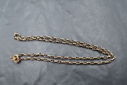 A 9ct rose gold fancy link chain bearing plaque stamped 9ct, approx 18' & 5.5g