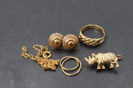 A small selection of yellow metal and 9ct gold jewellery including Rhino brooch, earrings, ring