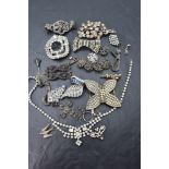A selection of vintage diamante and cut steel jewellery including buckles, bracelet, brooches etc